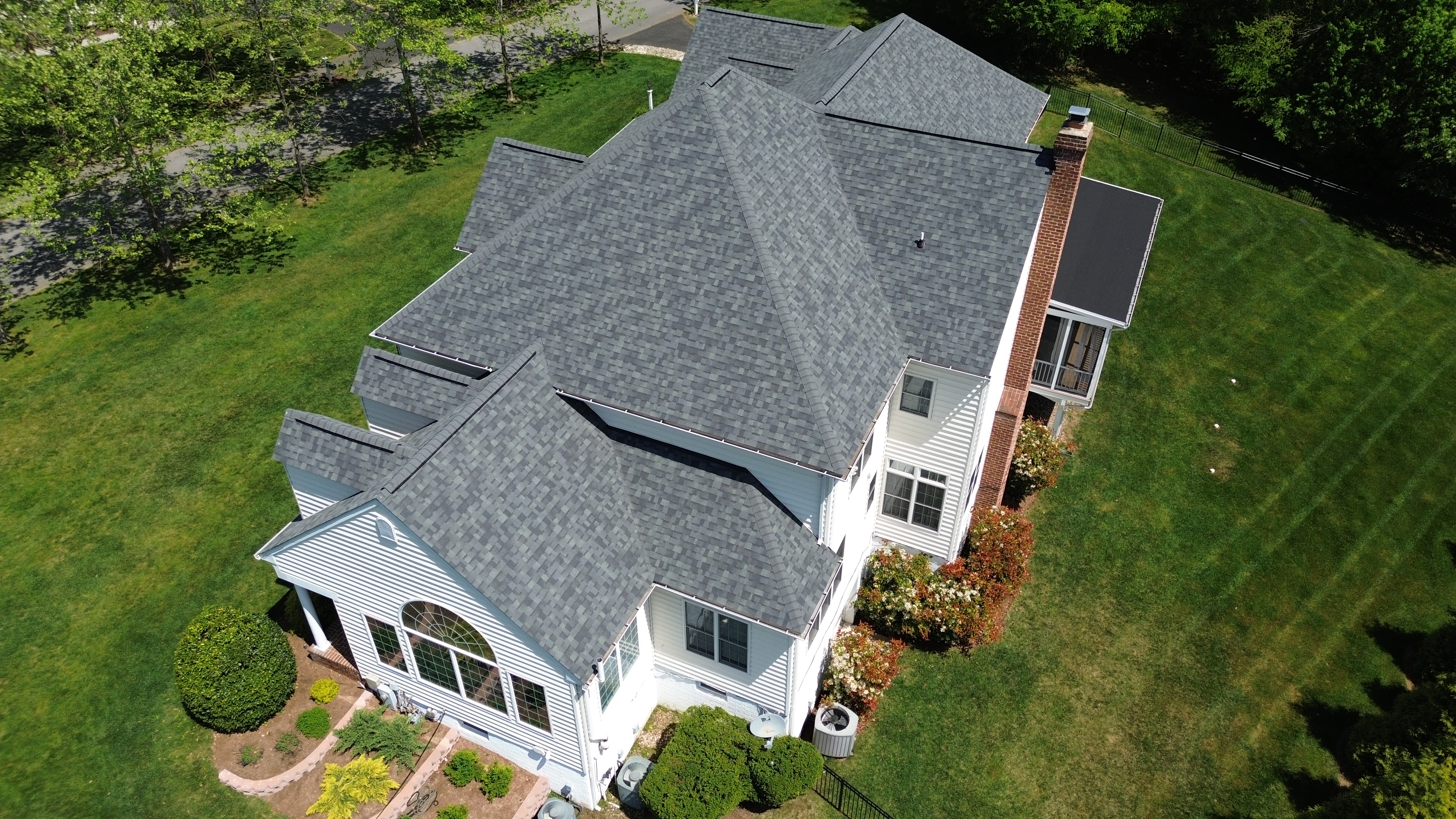 Completed roof replacement with charcoal shingles on a Millersville Maryland home by Prime Roofing & Siding