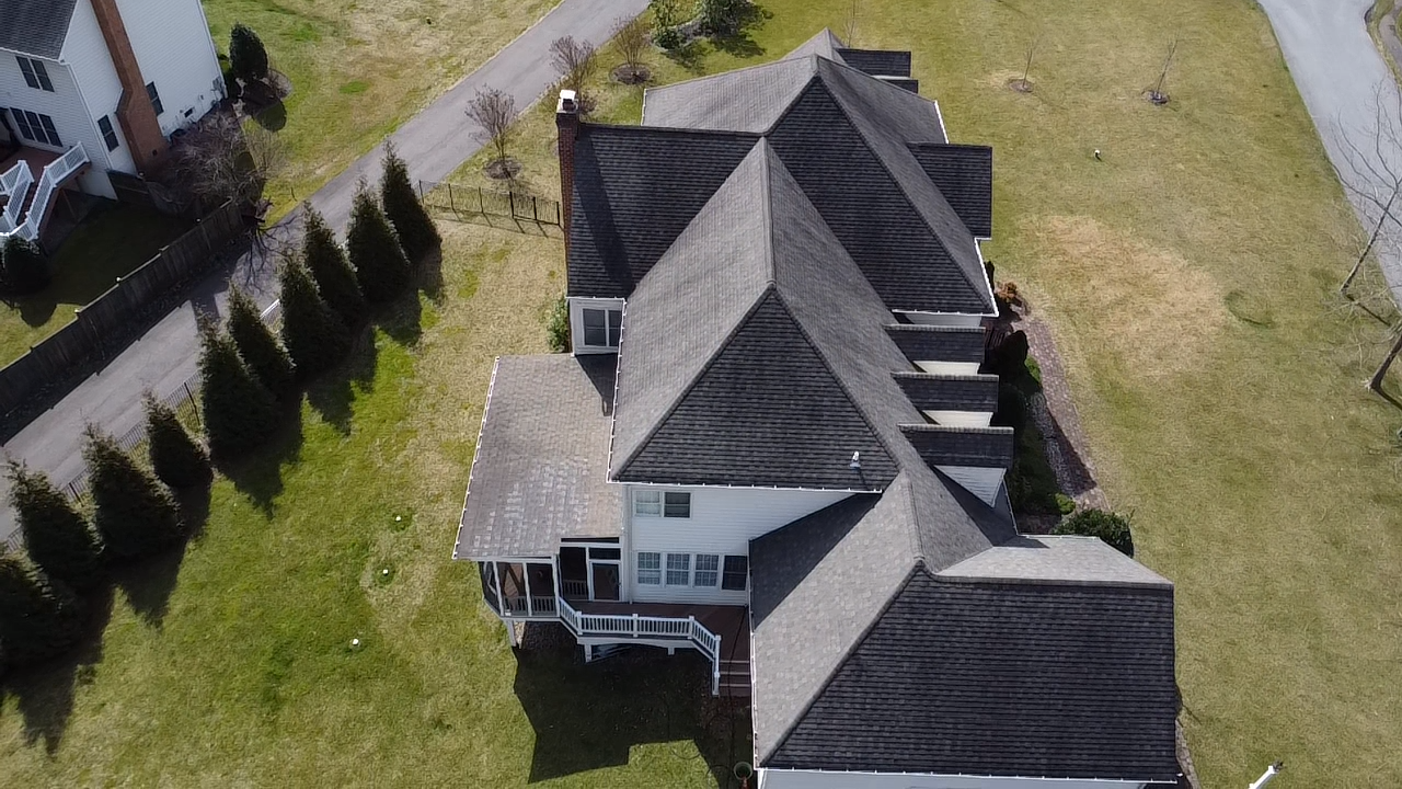 Old worn shingle roof on a Millersville MD home before replacement by Prime Roofing & Siding