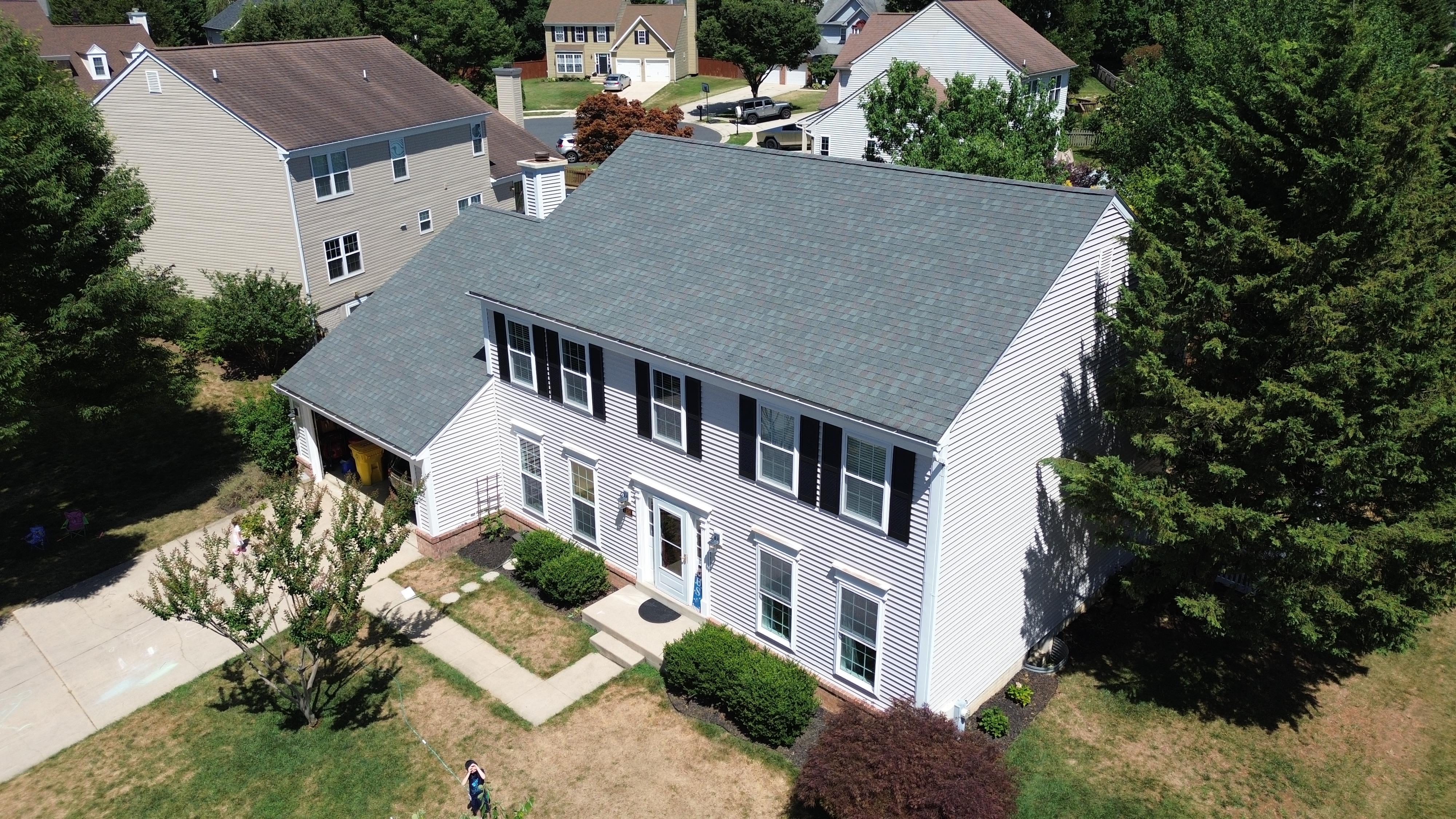 Completed siding installation on a Crofton MD colonial by Prime Roofing & Siding